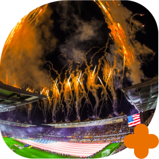 Fotografia do estádio Inter&Co com fogos de artifício e bandeira dos estados unidos