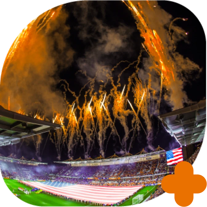 Fotografia do estádio Inter com fogos de artifício e bandeira dos estados unidos